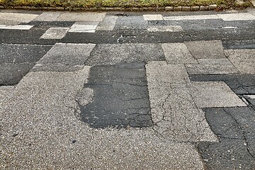 Image showing Patched broken road