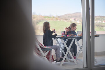 Image showing little girls playing with dolls