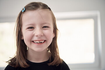 Image showing little girl without tooth smiling