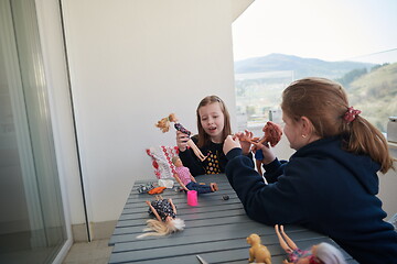 Image showing little girls playing with dolls