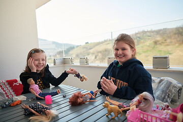 Image showing little girls playing with dolls