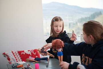 Image showing little girls playing with dolls