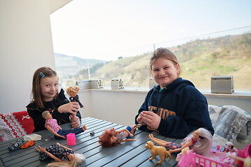 Image showing little girls playing with dolls