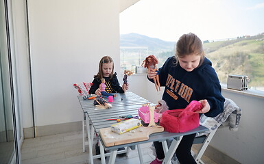 Image showing little girls playing with dolls