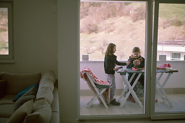 Image showing little girls playing with dolls