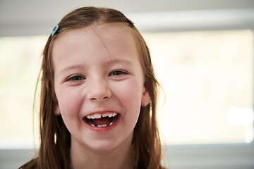 Image showing little girl without tooth smiling