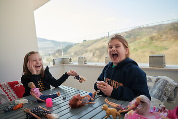 Image showing little girls playing with dolls