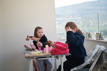 Image showing little girls playing with dolls