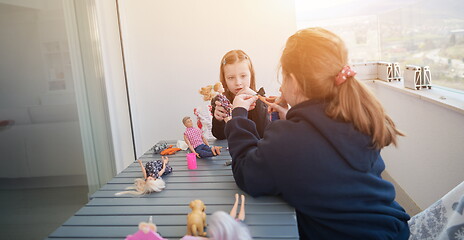 Image showing little girls playing with dolls