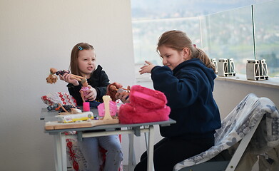 Image showing little girls playing with dolls