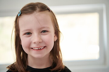 Image showing little girl without tooth smiling