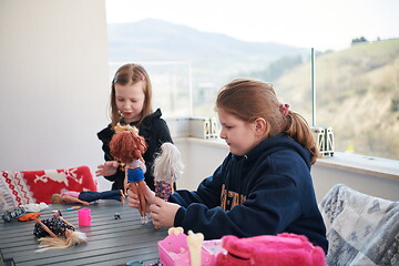 Image showing little girls playing with dolls