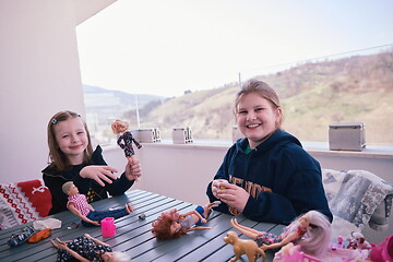 Image showing little girls playing with dolls