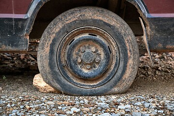 Image showing Flat Tire on abandoned wreck