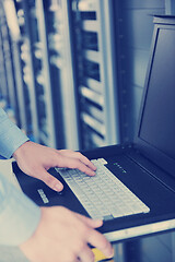 Image showing young it engeneer in datacenter server room