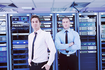 Image showing it enineers in network server room