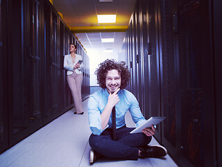 Image showing young technicians working together on servers