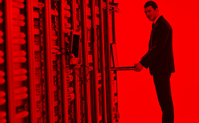 Image showing young engeneer in datacenter server room