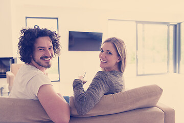 Image showing Rear view of couple watching television