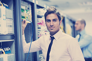 Image showing it engineers in network server room