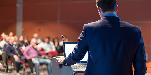 Image showing Public speaker giving talk at business event.