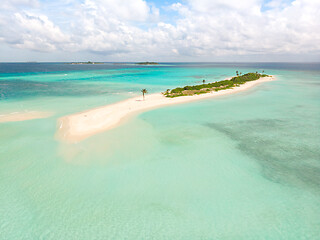 Image showing Picture perfect beach and turquoise lagoon on small tropical island on Maldives