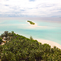 Image showing Aerial drone view of picture perfect beach and turquoise lagoon on small tropical island on Maldives