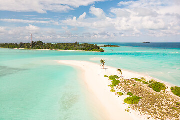 Image showing Picture perfect beach and turquoise lagoon on small tropical island on Maldives