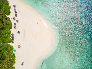 Image showing Aerial drone view of picture perfect beach and turquoise lagoon on small tropical island on Maldives