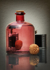 Image showing Still life with bottle and walnut