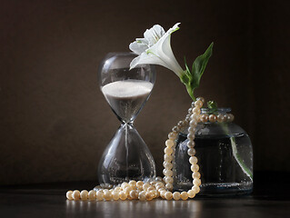 Image showing Alstroemeria flower and sandglass