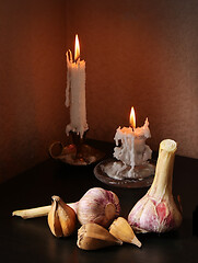 Image showing Garlic bulbs and candles