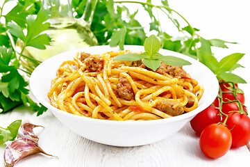 Image showing Spaghetti with bolognese in plate on wooden board