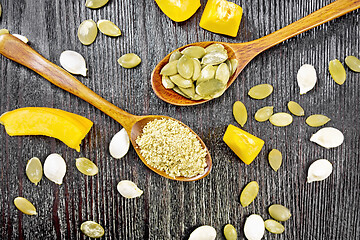 Image showing Flour and seeds pumpkin in spoons on board top