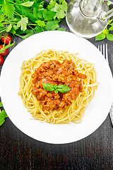 Image showing Spaghetti with bolognese on black board top