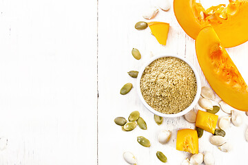 Image showing Flour pumpkin in white bowl on board top