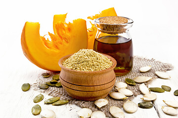 Image showing Flour pumpkin in bowl on board