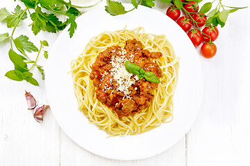 Image showing Spaghetti with bolognese on board top