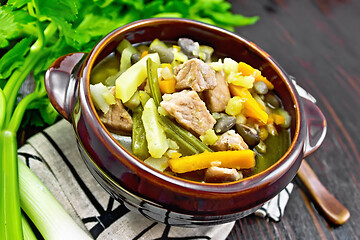 Image showing Soup Eintopf in clay bowl on dark board