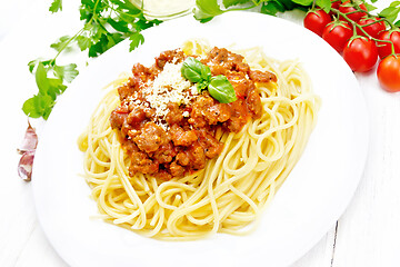 Image showing Spaghetti with bolognese on white wooden board