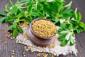 Image showing Fenugreek in bowl with leaves on dark board