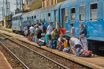 Image showing Group of students boarding a train