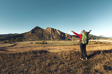 Image showing Backpack woman enjoying the view