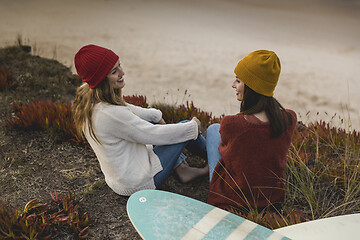 Image showing Surfer girls at the beach