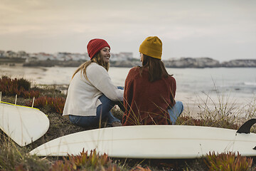 Image showing Surfer girls at the beach