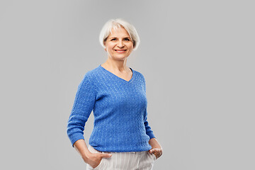 Image showing portrait of smiling senior woman in blue sweater