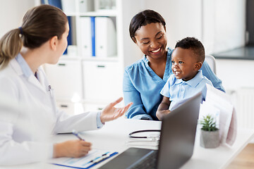 Image showing happy mother with baby son and doctor at clinic