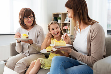 Image showing mother, daughter and grandmother eating cake