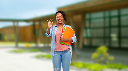 Image showing african american student woman with notebooks