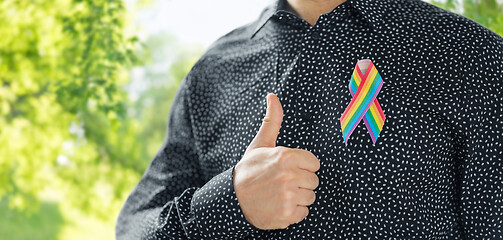 Image showing man with gay pride rainbow awareness ribbon